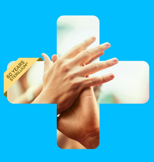 Two hands touching in the plus. Blue background. Banner with 60 years Sterillium.
