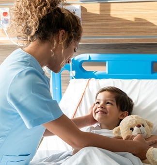 Children in bed with a nurse