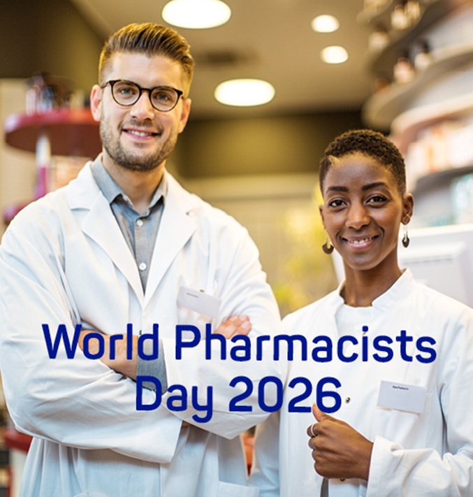 Two pharmacists in white coats stand smiling in a pharmacy with the text World Pharmacists Day 2026 displayed across the image.